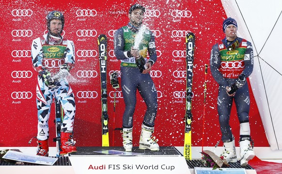 France&#039;s Mathieu Faivre, center, winner of an alpine ski, men&#039;s World Cup giant slalom, celebrates on the podium with second placed Austria&#039;s Marcel Hirscher, left, and third placed Fra ...