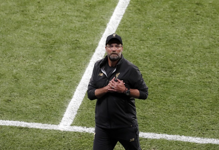 Liverpool coach Juergen Klopp gestures at the end of the Champions League final soccer match between Tottenham Hotspur and Liverpool at the Wanda Metropolitano Stadium in Madrid, Saturday, June 1, 201 ...