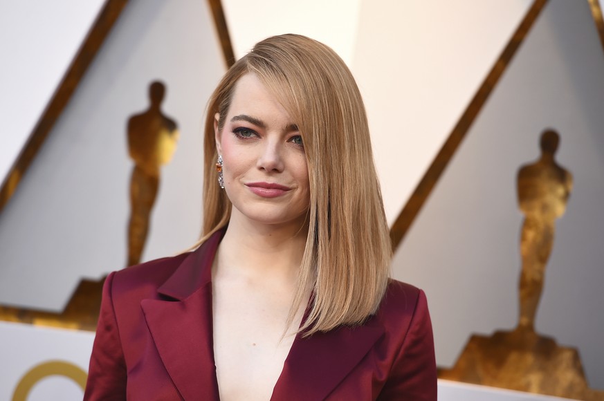 FILE - In this March 4, 2018, file photo, Emma Stone arrives at the Oscars in Los Angeles. Emma Stone plays Annie Landsberg and Jonah Hill plays Owen Milgrim in &quot;Maniac,&quot; about a radical kin ...