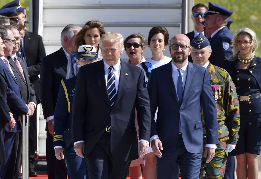 US President Donald Trump and Belgian Prime Minister Charles Michel walk together during arrival at Melsbroek Military Airport in Melsbroek, Belgium on Wednesday, May 24, 2017. US President Donald Tru ...