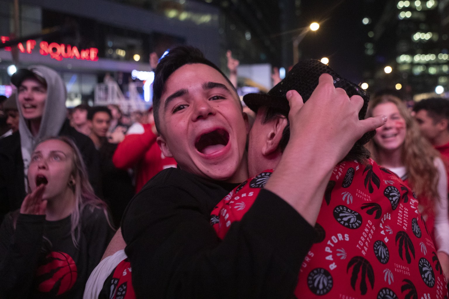 Toronto Raptors fans celebrate outside the arena in the closing seconds of the team&#039;s 100-94 win over the Milwaukee Bucks in Game 6 of the NBA basketball playoffs Eastern Conference finals Saturd ...