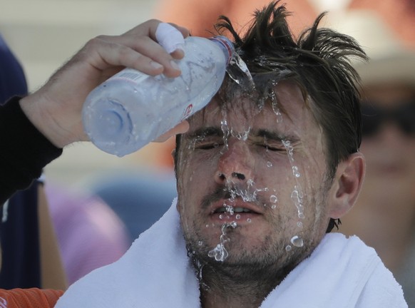 Stan Wawrinka, of Switzerland, pours water on his face during a changeover in his match against Ugo Humbert, of France, during the second round of the U.S. Open tennis tournament, Wednesday, Aug. 29,  ...