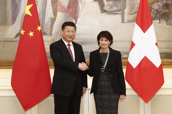 Swiss Federal President Doris Leuthard, right, and China&#039;s President Xi Jinping shake hands prior to the official talks during Xi&#039;s two days state visit to Switzerland in Bern, Switzerland,  ...