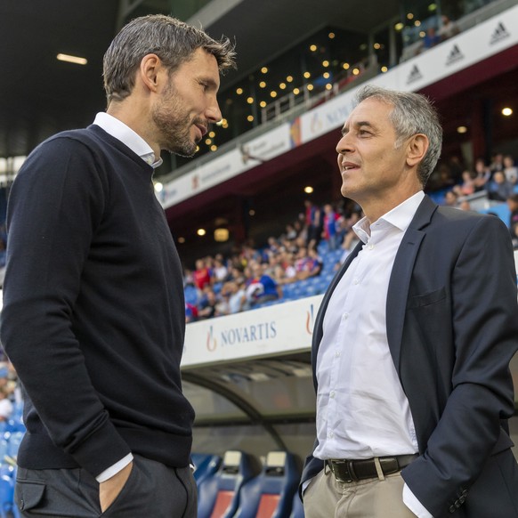 PSV&#039;s head coach Mark Van Bommel, left, and Basel&#039;s head coach Marcel Koller, right, prior to the UEFA Champions League second qualifying round second leg match between Switzerland&#039;s FC ...
