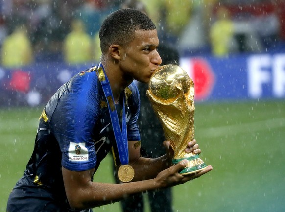 epa06891472 Kylian Mbappe of France kisses the FIFA World Cup 2018 trophy after the FIFA World Cup 2018 final between France and Croatia in Moscow, Russia, 15 July 2018.

(RESTRICTIONS APPLY: Editor ...