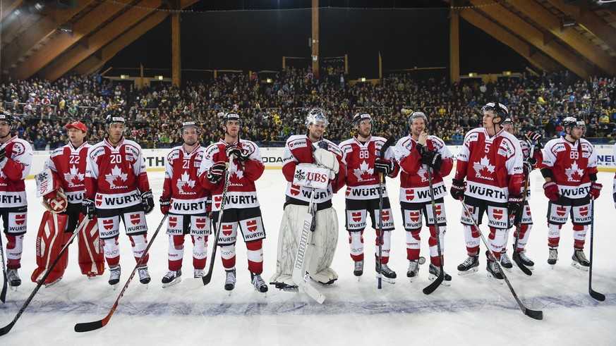 Players of Team Canada line up after winning the game between Team Canada and Switzerland&#039;s HC Davos, at the 89th Spengler Cup ice hockey tournament in Davos, Switzerland, on Monday, December 28, ...