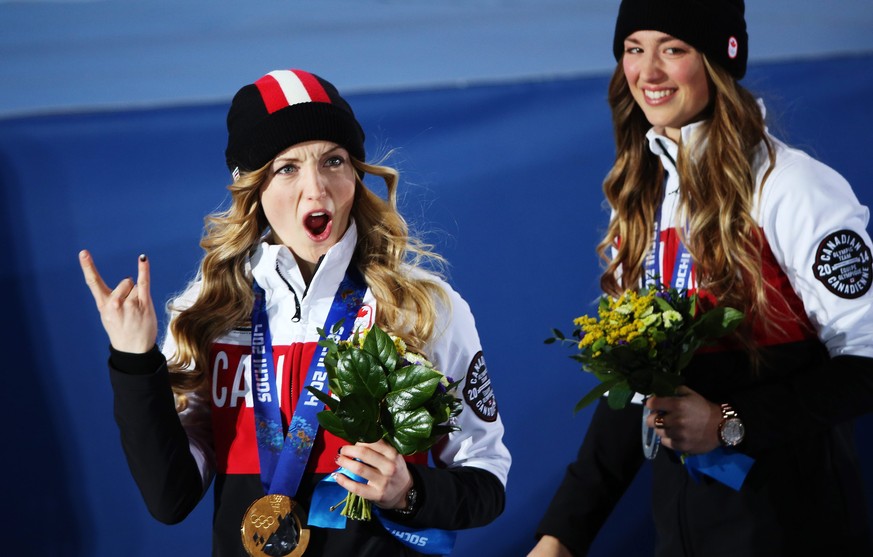 epa04064811 Gold medallist Justine Dufour-Lapointe (L) of Canada and silver medalist Chloe Dufour-Lapointe (R) of Canada after the medal ceremony for the Freestyle Skiing Women&#039;s Moguls at the So ...