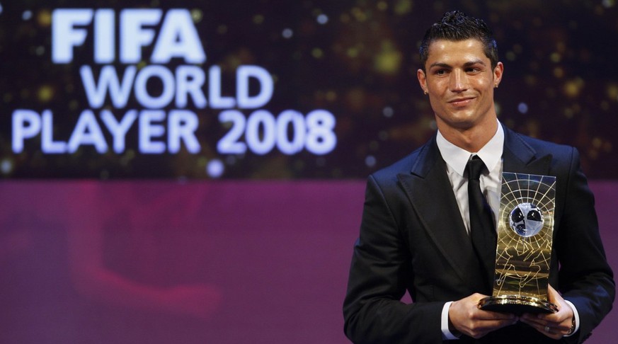 Soccer player Cristiano Ronaldo from Portugal poses with the trophy after being named FIFA World Player of the Year during the FIFA World Player Gala 2008 at the Opera house in Zurich, Switzerland, Mo ...
