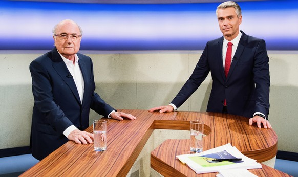 HANDOUT - Suspended FIFA-President Joseph &quot;Sepp&quot; Blatter, left, and TV-Journalist Sandro Brotz, right, pose during the recording for the broadcast &quot;Rundschau&quot;, at the TV-Studios of ...