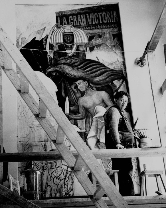 Muralist Diego Rivera works on one of the panels of a mural in the Hotel Reforma in Mexico, December 3, 1936. The political content of the work resulted in the removal of the mural and the incarcerati ...