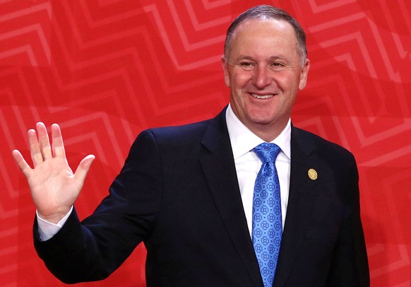 New Zealand&#039;s Prime Minister John Key waves to photographers during the APEC (Asia-Pacific Economic Cooperation) Summit in Lima, Peru, November 20, 2016. REUTERS/Mariana Bazo/File photo