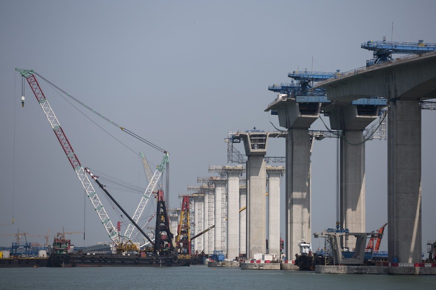 epa05298689 Construction work takes place on the Hong Kong Link Road, part of the Hong Kong-Zhuhai-Macau Bridge (HZMB) in Hong Kong, China, 11 May 2016. When completed, the 12 km long Hong Kong Link R ...