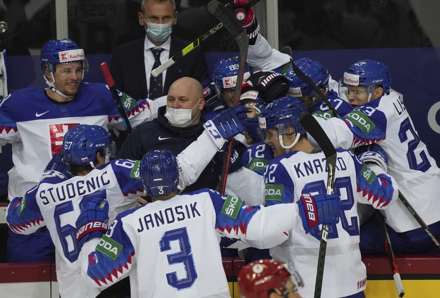 Slovakia&#039;s team players celebrate goal during the Ice Hockey World Championship group A match between the Slovakia and Russia at the Olympic Sports Center in Riga, Latvia, Monday, May 24, 2021. ( ...