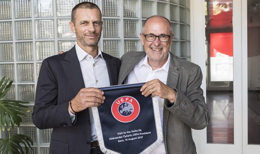 UEFA President Aleksander Ceferin, left, pays a visit to the Swiss Football Federation SFV, where he is welcomed by SFV President Peter Gillieron, in Muri near Bern, Switzerland, on Tuesday, August 15 ...