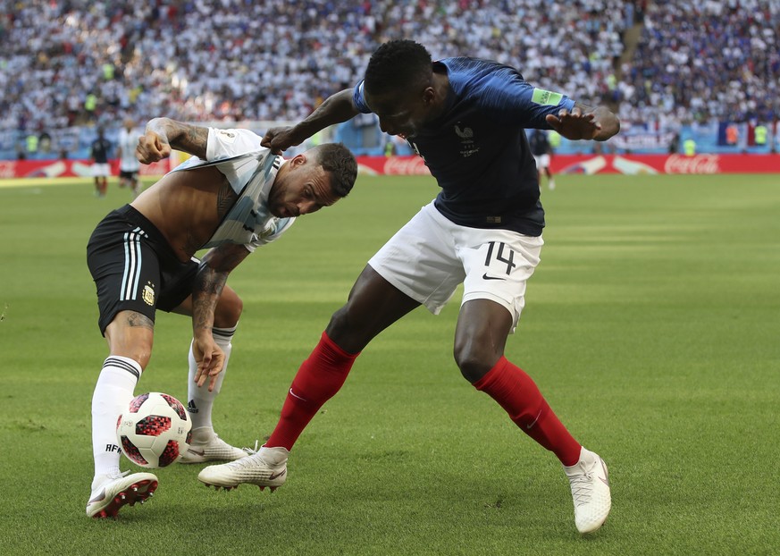 Argentina&#039;s Nicolas Otamendi, left, battles with France&#039;s Blaise Matuidi during the round of 16 match between France and Argentina, at the 2018 soccer World Cup at the Kazan Arena in Kazan,  ...