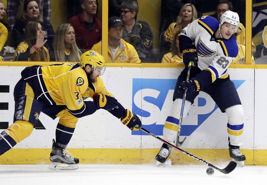 Nashville Predators defenseman Yannick Weber (7), of Switzerland, blocks a shot by St. Louis Blues right wing Dmitrij Jaskin (23), of Russia, during the first period in Game 6 of a second-round NHL ho ...