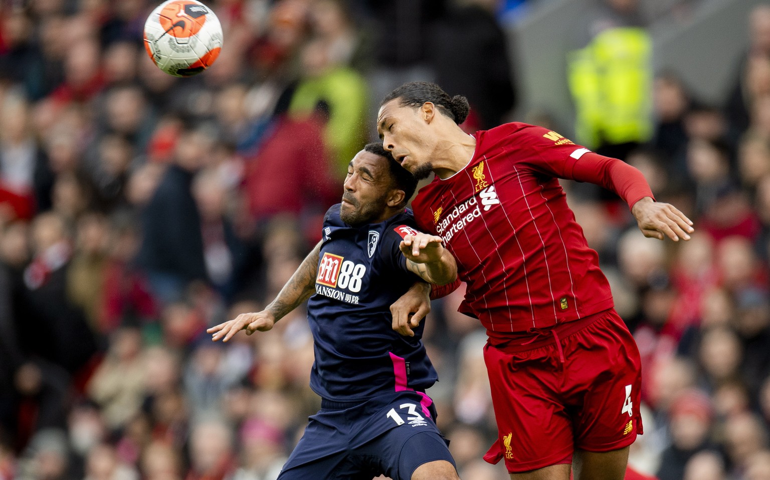 epa08276348 Bournemouth&#039;s Callum Wilson (L) in action with Liverpool&#039;s Virgil van Dijk (R) during the English Premier League soccer match between Liverpool and Bournemouth at Anfield, Liverp ...