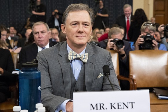 epa07993345 Deputy Assistant Secretary of State for Europe and Eurasia George Kent (C) arrives to testify before the House Permanent Select Committee on Intelligence hearing on the impeachment inquiry ...