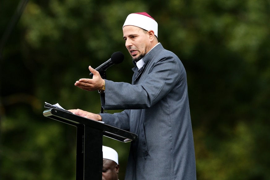 epa07454754 Imam Gamal Fouda leads a prayer at Hagley Park, opposite the Al Noor Mosque, in Christchurch, New Zealand, 22 March 2019. New Zealand Prime Minister Jacinda Ardern announced on 21 March, t ...