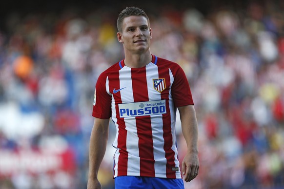 Atletico Madrid&#039;s new signing Kevin Gameiro walks along the pitch during his official presentation at the Vicente Calderon stadium in Madrid, Sunday, July 31, 2016. French striker Gameiro has sig ...