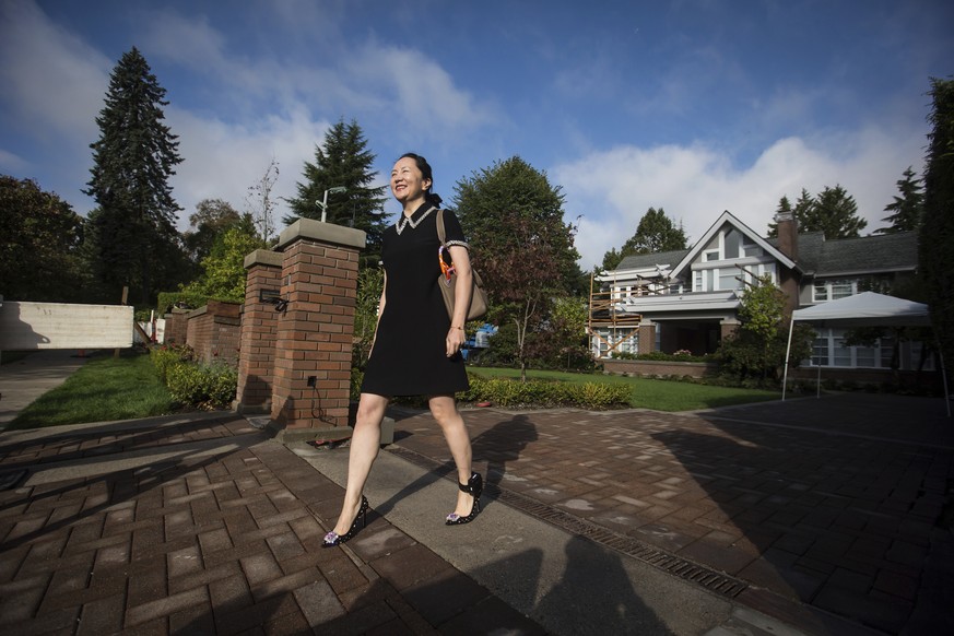 Huawei chief financial officer Meng Wanzhou, who is out on bail and remains under partial house arrest after she was detained last year at the behest of American authorities, leaves her home to attend ...