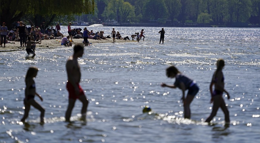epa07515691 Peaople enjoy the weather during the opening of the swimming season at Strandbad beach at Wannsee lake in Berlin, Germany, 19 April 2019. Swimming season officially started on Good Friday, ...