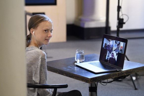 epa08377014 Environmental activist Greta Thunberg has a video conversation with Johan Rockström, who participates via a link from Germany, about the corona virus and the environment at the Nobel Museu ...