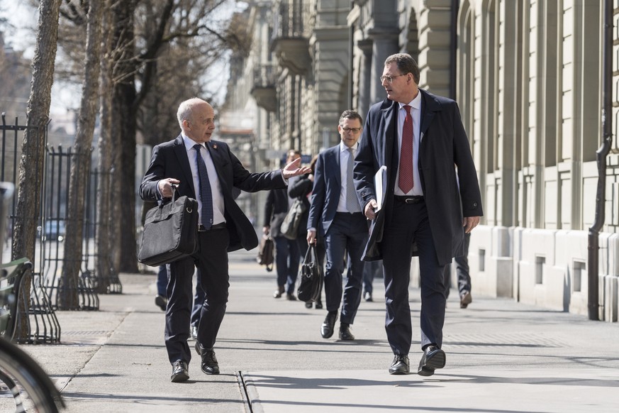 Swiss Federal councillor and finance minister Ueli Maurer, left, and Thomas Jordan, chairman of the governing board of the Swiss National Bank, walk to a media brief about the latest economic measures ...