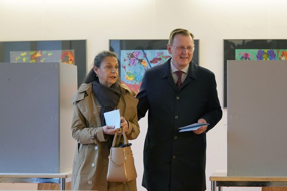 epa07953002 Minister President of Thuringia Bodo Ramelow (R) of The Left (Die Linke) party casts his ballot next to his wife Germana Alberti vom Hofe (L) during the Thuringia state elections, at a pol ...