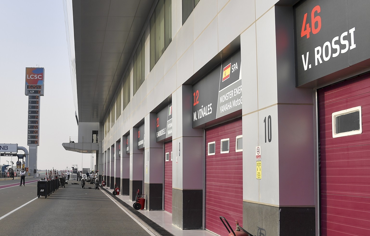 epa08276371 The garages are closed at the Losail International Circuit after cancelling the Qatar MotoGP race, in Doha, Qatar, 07 March 2020. The season-opening MotoGP race in Qatar was cancelled beca ...