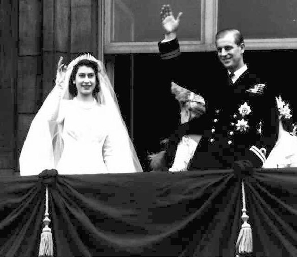 Britain&#039;s Queen Elizabeth II and her husband Prince Philip, wave from the balcony of London&#039;s Buckingham Palace, following their wedding at Westminster Abbey, in this November 20, 1947 file  ...