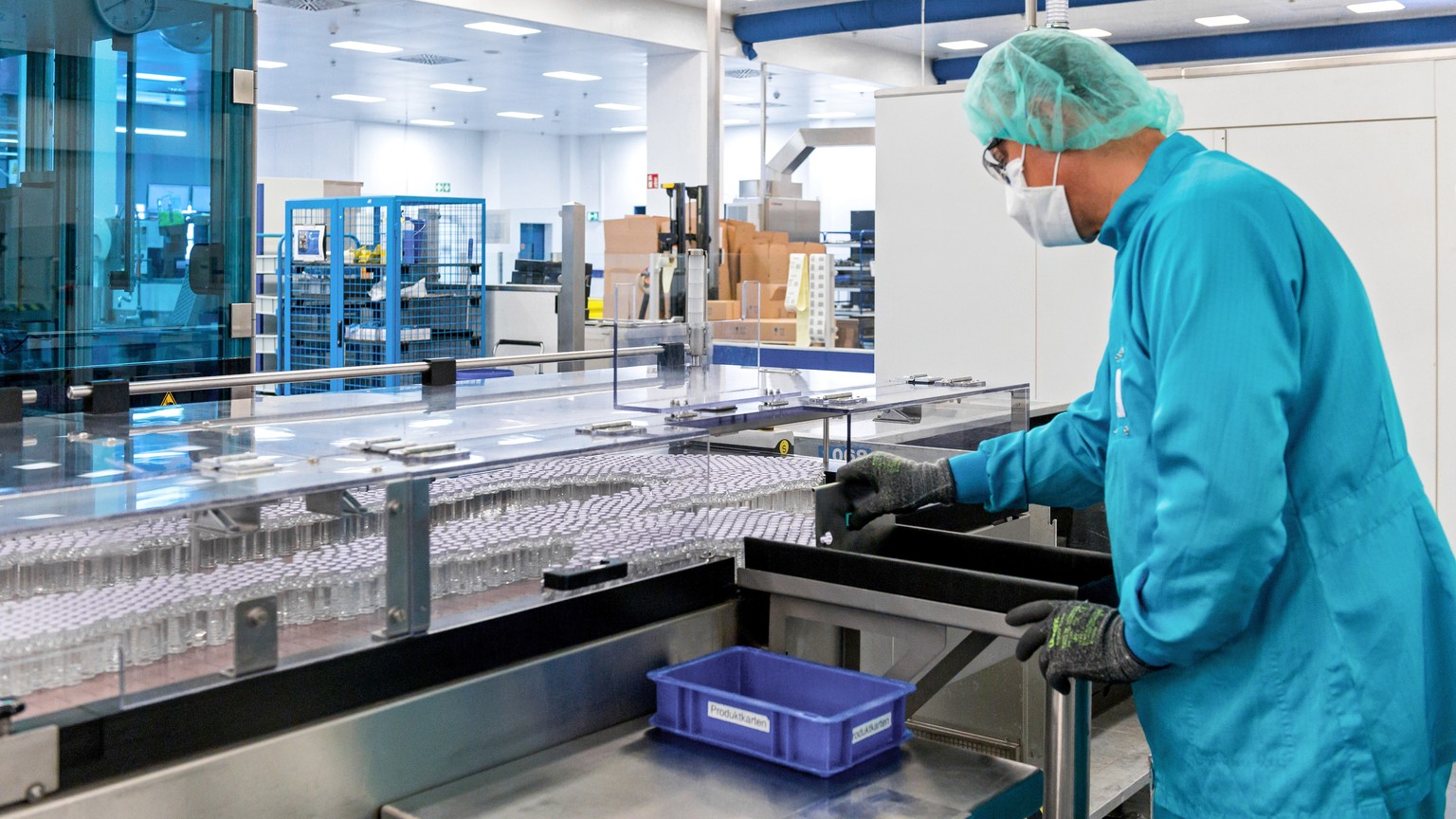 epa08688482 A handout photo made available by Sanofi shows an employee in the production of a possible Covid-19 vaccine in Frankfurt am Main, Germany, 15 September 2020 (issued 22 September 2020). The ...