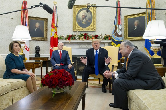 epa07224219 US President Donald J. Trump (C) and US Vice President Mike Pence (2-L) meet with US House Speaker-designate Nancy Pelosi (L) and US Senate Minority Leader Chuck Schumer (R), in the Oval O ...