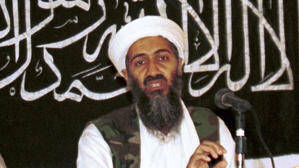 FILE - In this 1998 file photo made available on March 19, 2004, Osama bin Laden is seen at a news conference in Khost, Afghanistan. Never-before seen video of Osama bin Laden’s son and potential succ ...