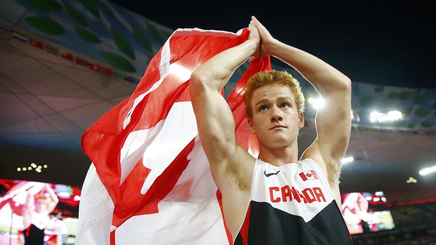 Shawnacy Barber of Canada celebrates after winning gold in the men&#039;s pole vault final during the 15th IAAF World Championships at the National Stadium in Beijing, China August 24, 2015. REUTERS/K ...