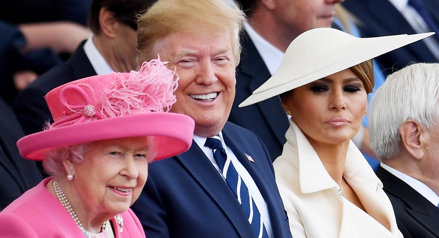 epaselect epa07627311 (L-R) Britain&#039;s Queen Elizabeth II, US President Donald J. Trump, First Lady Melania Trump attending the commemorations for the 75th Anniversary of the D-Day landings in Sou ...