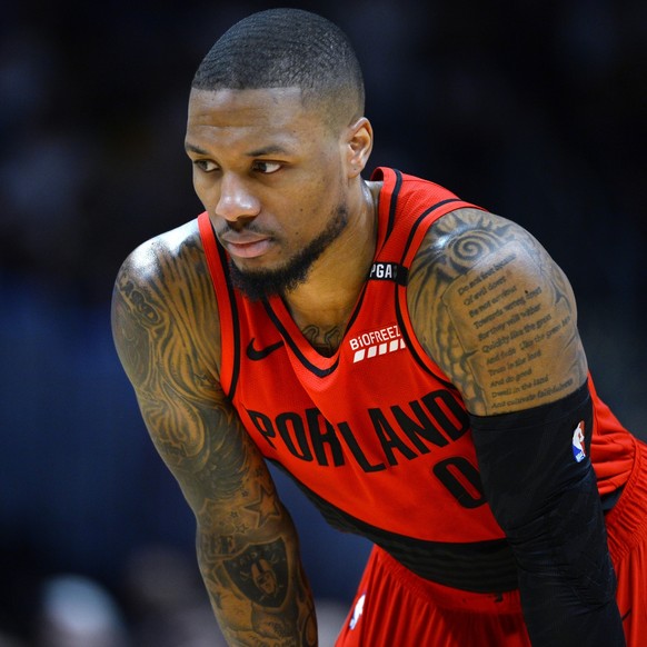 Portland Trail Blazers guard Damian Lillard looks on during a foul shot in the first half of Game 7 of an NBA basketball second-round playoff series against the Denver Nuggets Sunday, May 12, 2019, in ...