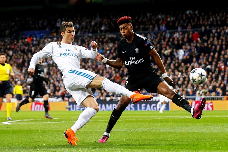epa06525566 Paris Saint-Germain&#039;s Presnel Kimpembe (R) in action against Real Madrid&#039;s Cristiano Ronaldo (L) during the UEFA Champions League round of 16, first leg soccer match between Real ...