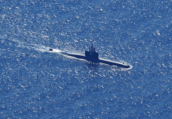 epa09152692 An aerial photo taken from a maritime patrol aircraft of 800 Air Squadron of the 2nd Air Wing of Naval Aviation Center (PUSPENERBAL), shows Indonesian Navy submarine KRI Alugoro sailing on ...