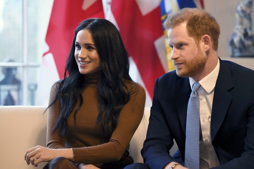 FILE - In this Tuesday, Jan. 7, 2020 file photo, Britain&#039;s Prince Harry and Meghan, Duchess of Sussex smile during their visit to Canada House, in London. Prince Harry and his wife Meghan &#039;s ...
