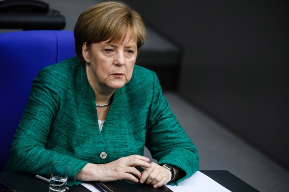 epa06846354 German Chancellor Angela Merkel sits on the government bench after her speech to the German Bundestag in Berlin, Germany, 28 June 2018. Merkel delivered a government declaration to the mem ...