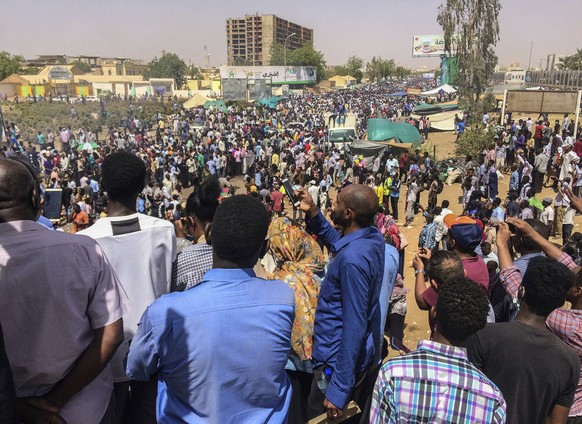 Protesters rally at a demonstration near the military headquarters, Tuesday, April 9, 2019, in the capital Khartoum, Sudan. Activists behind anti-government protests in Sudan say security forces have  ...