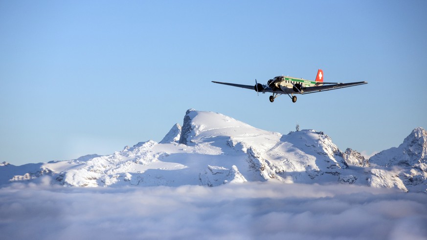 epa06928797 A undated handout photo made available by Swiss JU-AIR showing a historic JU-52 aircraft of the JU-AIR in the air. A JU-52 of the JU-AIR crashed on 04 August 2018 at Piz Segnas above Flims ...