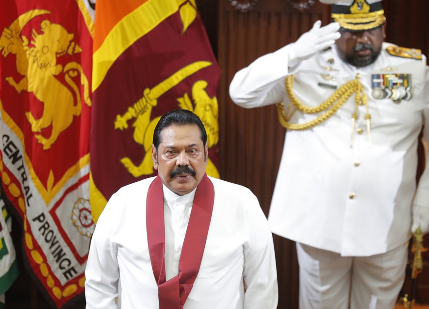 Sri Lanka&#039;s new Prime Minister Mahinda Rajapaksa stands for the national anthem at the presidential secretariat in Colombo, Sri Lanka, Thursday, Nov. 21, 2019. President Gotabaya Rajapaksa is exp ...