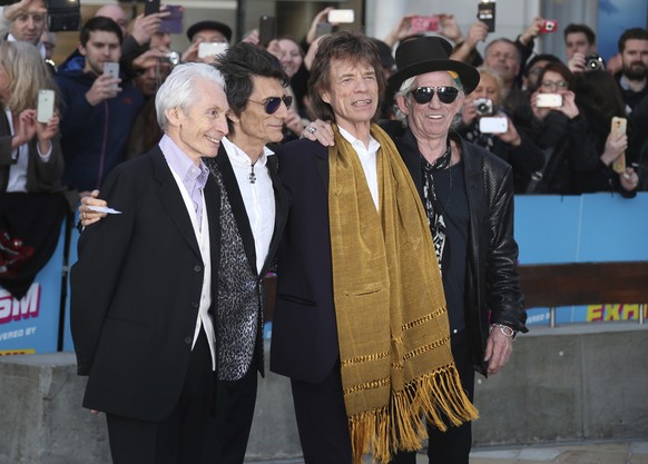 FILE - This April 4, 2016 file photo shows members of The Rolling Stones, from left, Charlie Watts, Ronnie Wood, Mick Jagger and Keith Richards at the Rolling Stones Exhibitionism preview in London. T ...