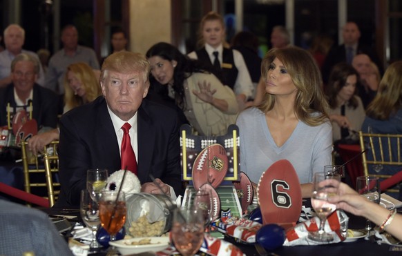President Donald Trump and first lady Melania Trump attend a Super Bowl party at Trump International Golf Club in West Palm Beach, Fla., Sunday, Feb. 5, 2017. (AP Photo/Susan Walsh)