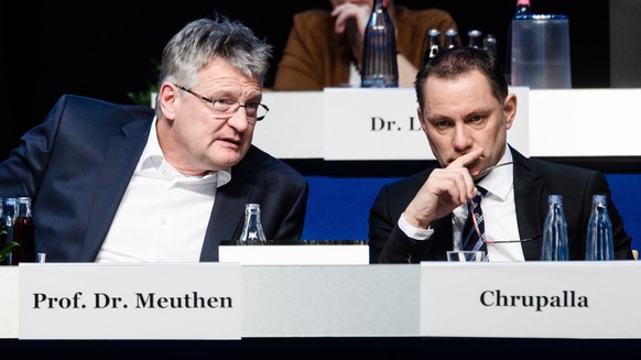 epa08037472 Alternative for Germany party (AfD) co-chairman Joerg Meuthen (L) and Alternative for Germany party (AfD) co-chairman Tino Chrupalla talk during the party convention of the German right-wi ...