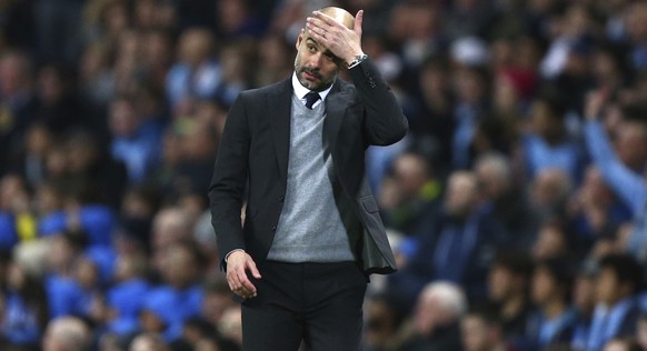 Manchester City&#039;s manager Pep Guardiola gestures during the Champions League round of 16 first leg soccer match between Manchester City and Monaco at the Etihad Stadium in Manchester, England, Tu ...
