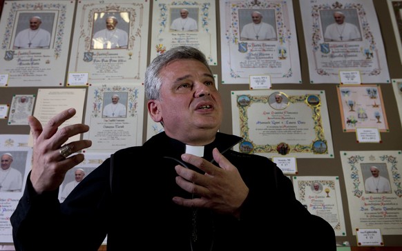 FILE - This Nov. 29, 2013 file photo shows Mons. Konrad Krajewski during an interview with The Associated Press in his office at the Vatican. Pope Francis this summer is treating dozens of Rome&#039;s ...