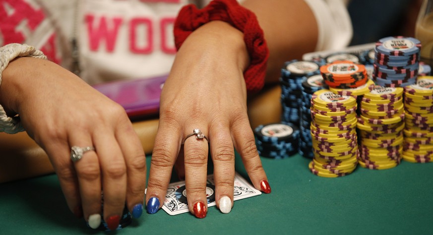 In this June 27, 2015, photo, Tanya Stendzis holds her cards while playing in the Ladies No-Limit Hold&#039;em Championship during the World Series of Poker in Las Vegas. Poker is still a man&#039;s g ...
